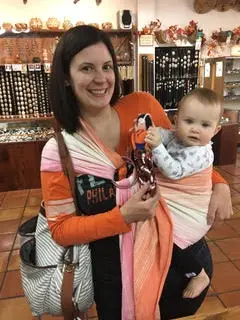 an image of a mum with her baby in the best baby sling carrier