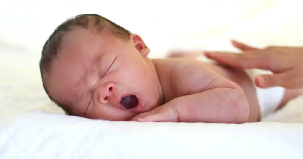 an image of a baby yawning