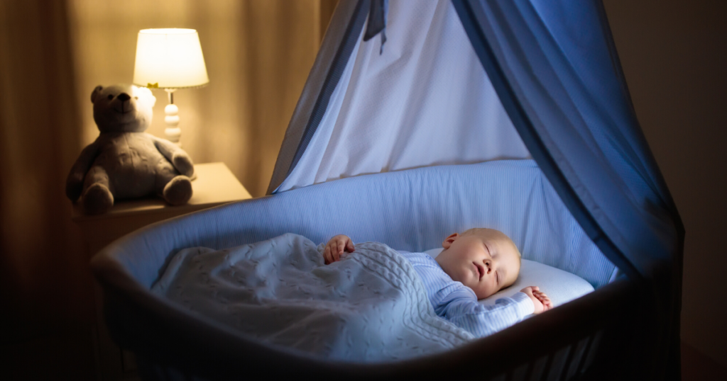 an image of the best baby night light lighting a baby's crib